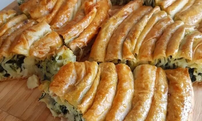 Ispanaklı börek, hem kahvaltı sofralarının hem de özel davetlerin vazgeçilmez lezzetlerinden biridir. İncecik açılmış yufkaların arasında yer alan ıspanak, böreğe hem doğal bir renk hem de zengin bir besin değeri katar. Ispanaklı börek, özellikle ev yapımı olduğunda, hem lezzet hem de sağlık açısından sofralara değer katar. Bu yazımızda ıspanaklı böreğin tarihçesinden malzeme seçimlerine, hazırlık aşamalarından pişirme tekniklerine kadar detaylı bilgiler bulabilirsiniz. Konulu bir haber görseli.