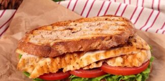 Tavuklu sandviç, günümüzde en çok tercih edilen pratik öğünlerden biri olarak öne çıkar. Kökeni, 20. yüzyılın başlarına kadar uzanan bu sandviç, hızlı hazırlanan ve doyurucu bir yemek alternatifi olarak popülerlik kazanmıştır. İlk olarak Amerika ve Avrupa’da yaygınlaşan tavuklu sandviç, kısa sürede dünya mutfaklarında standart bir seçenek haline gelmiştir. Konulu bir haber görseli.